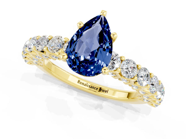 Yellow gold Pear Cut Blue Sapphire Solitaire Ring with Shared Prong Pavé Band and Four-Prong Setting