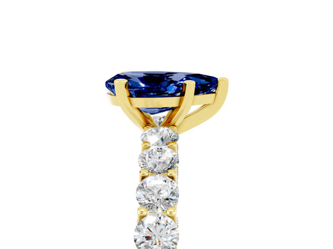 Yellow gold Pear Cut Blue Sapphire Solitaire Ring with Shared Prong Pavé Band and Four-Prong Setting_17
