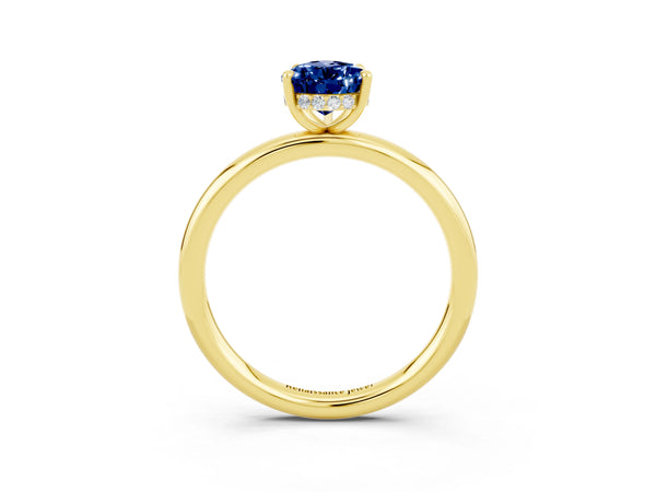 Yellow gold Pear Cut Blue Sapphire Solitaire Ring with Thin Band and Four-Prong Setting