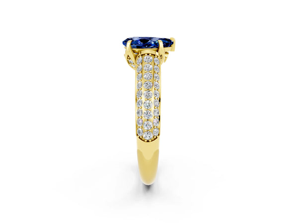 Yellow gold Pear Cut Blue Sapphire Solitaire Ring with Three-Row Pavé Band and Four-Prong Setting