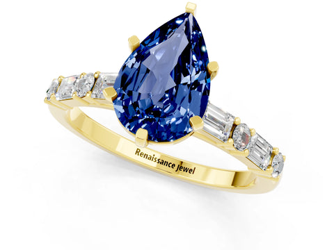 Yellow gold Pear Cut Blue Sapphire Solitaire with Side Baguettes and Channel Set Band_1