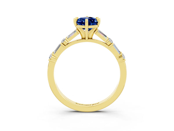 Yellow gold Pear Cut Blue Sapphire Solitaire with Side Baguettes and Channel Set Band