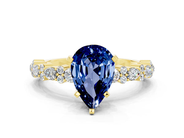 Yellow gold Pear Cut Blue Sapphire Side Stone Solitaire Ring with Round  and Four-Prong Setting