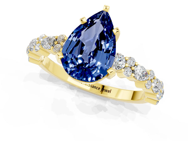 Yellow gold Pear Cut Blue Sapphire Side Stone Solitaire Ring with Round  and Four-Prong Setting