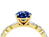 Yellow gold Pear Cut Blue Sapphire Solitaire with Side Stones on a Pavé Band and Four-Prong Setting_4