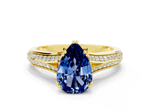 Yellow gold Pear Cut Blue Sapphire Split Shank Engagement Ring with Pavé Band