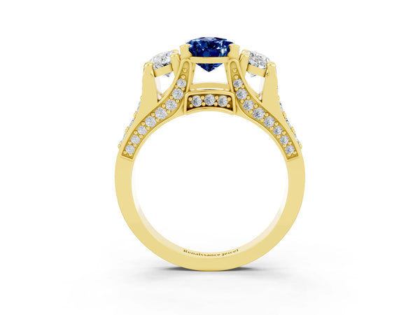 Yellow gold Pear Cut Blue Sapphire Three-Stone Ring with Channel Set Band and Four-Prong Setting