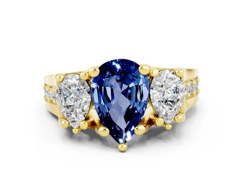 Yellow gold Pear Cut Blue Sapphire Three-Stone Ring with Channel Set Band and Four-Prong Setting