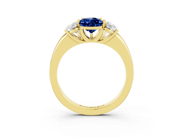 Yellow gold Pear Cut Blue Sapphire Three-Stone Ring with Four-Prong Setting and Classic Band