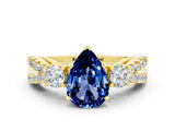 Yellow gold Pear Cut Blue Sapphire Three-Stone Ring with Pavé Split Shank and Four-Prong Setting_12