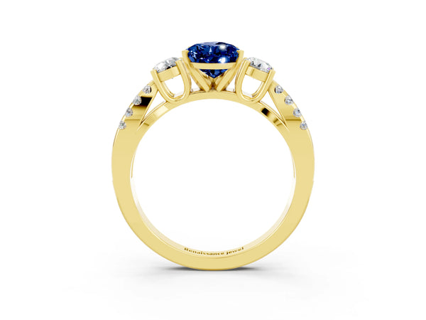 Yellow gold Pear Cut Blue Sapphire Three-Stone Ring with Pavé Split Shank and Four-Prong Setting