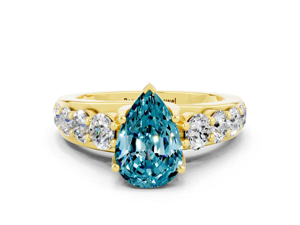 Yellow gold Pear Cut Blue Topaz Engagement Ring with Pavé Band and Four-Prong Setting