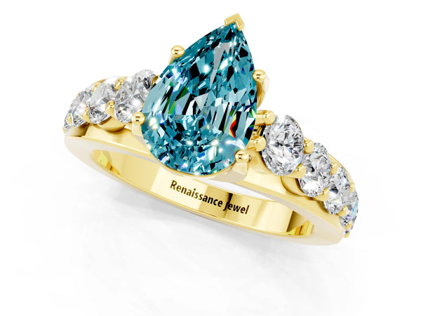 Yellow gold Pear Cut Blue Topaz Engagement Ring with Pavé Band and Four-Prong Setting