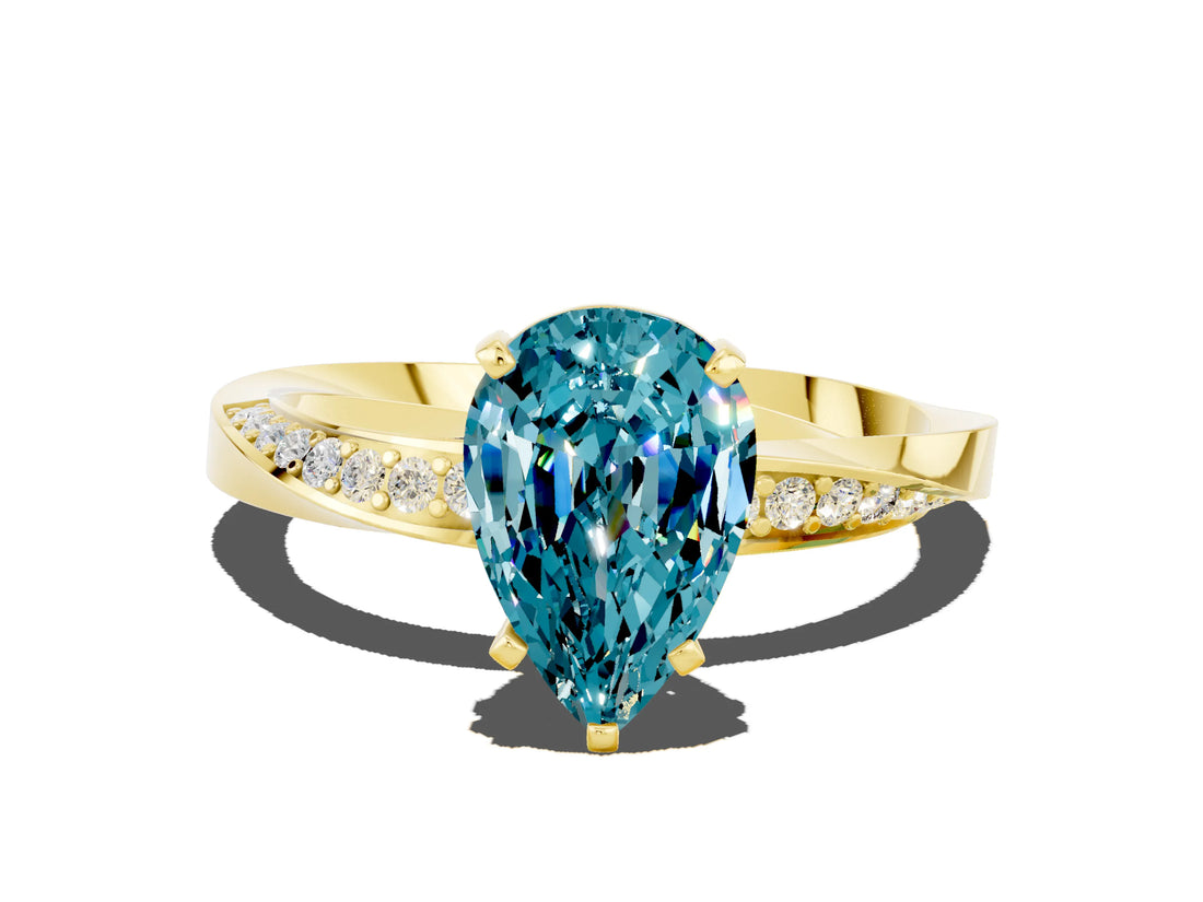 Yellow gold Pear Cut Blue Topaz Engagement Ring with Side Stone Accents and Four-Prong Setting_60