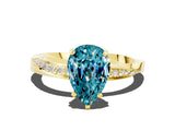 Yellow gold Pear Cut Blue Topaz Engagement Ring with Side Stone Accents and Four-Prong Setting_60