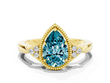 Yellow gold Pear Cut Blue Topaz Halo Ring with Tapered Band and Four-Prong Setting