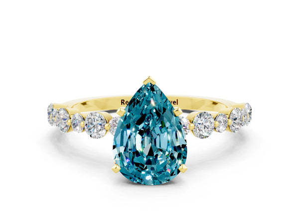 Yellow gold Pear Cut Blue Topaz Prong Set Engagement Ring with Pavé Band