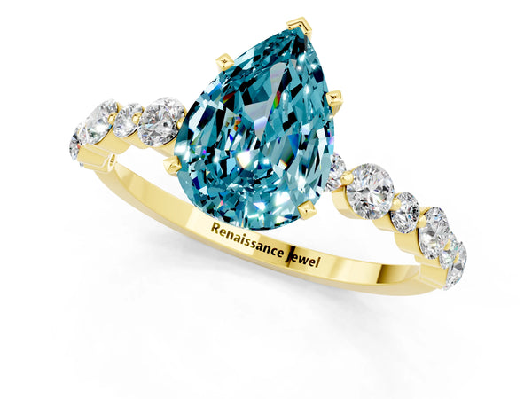 Yellow gold Pear Cut Blue Topaz Prong Set Engagement Ring with Pavé Band