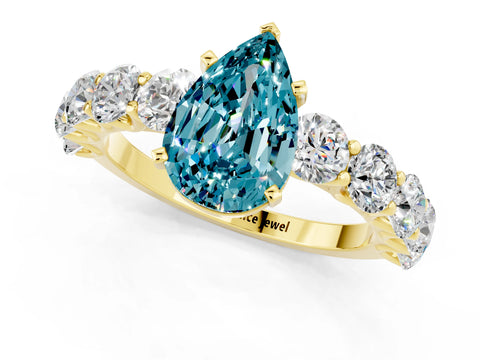 Yellow gold Pear Cut Blue Topaz Prong Setting with Side Stones on a Pave Band_1