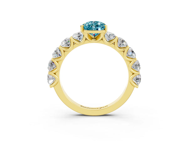 Yellow gold Pear Cut Blue Topaz Prong Setting with Side Stones on a Pave Band