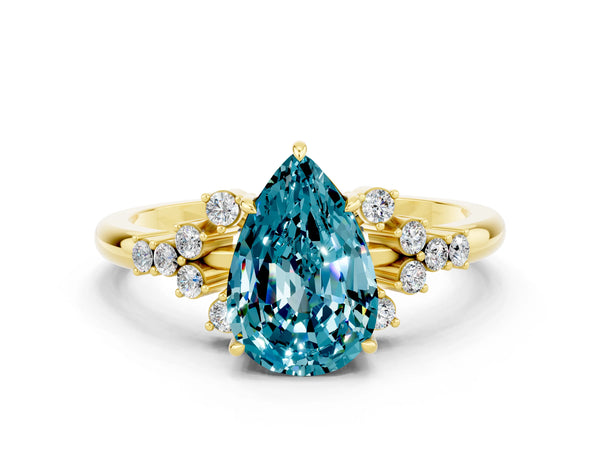 Yellow gold Pear Cut Blue Topaz Ring with Side Stones and Four-Prong Setting