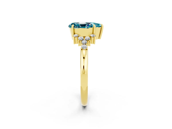 Yellow gold Pear Cut Blue Topaz Ring with Side Stones and Four-Prong Setting