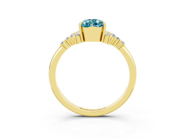 Yellow gold Pear Cut Blue Topaz Ring with Side Stones and Four-Prong Setting