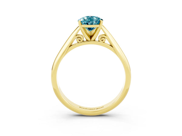 Yellow gold Pear Cut Blue Topaz Solitaire Engagement Ring with Cathedral Setting and Four-Prong Mount