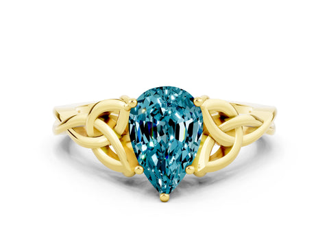 Yellow gold Pear Cut Blue Topaz Solitaire Engagement Ring with Celtic Knot Band and Four-Prong Setting