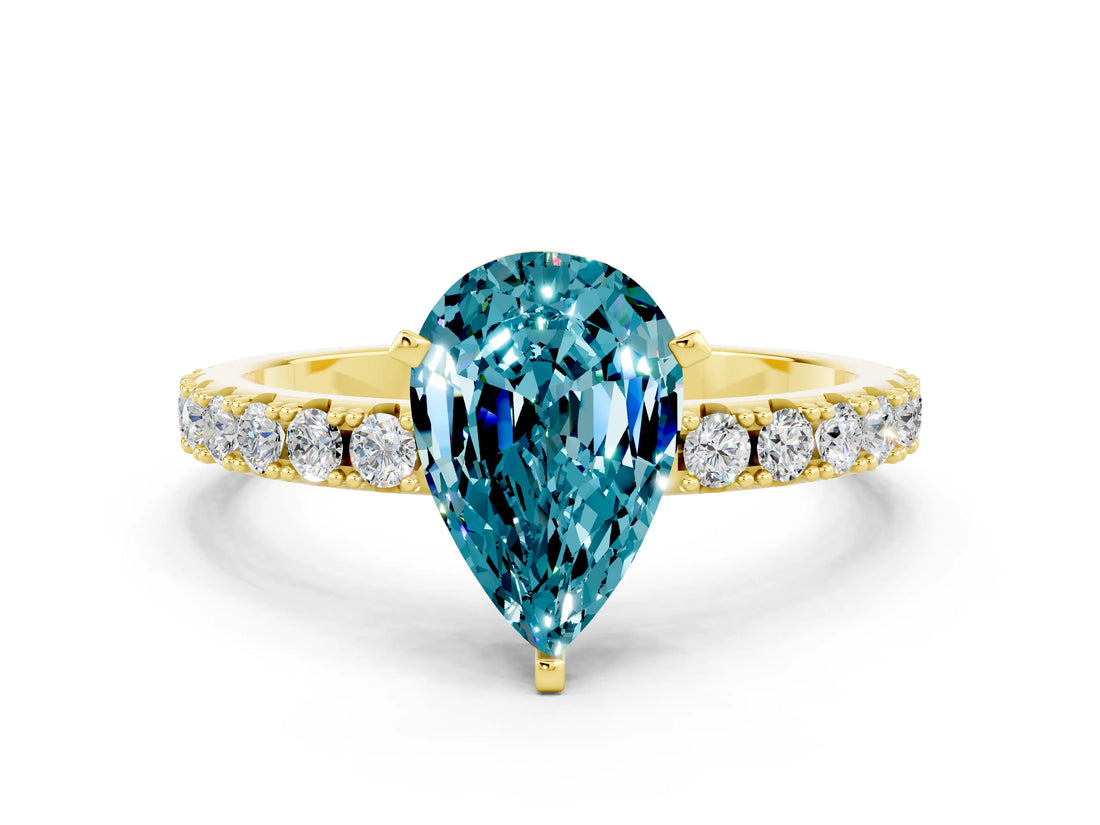 Yellow gold Pear Cut Blue Topaz Solitaire Pavé Band with Four-Prong Setting