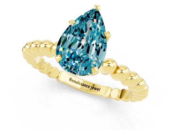 Yellow gold Pear Cut Blue Topaz Solitaire Ring with Beaded Band and Prong Setting