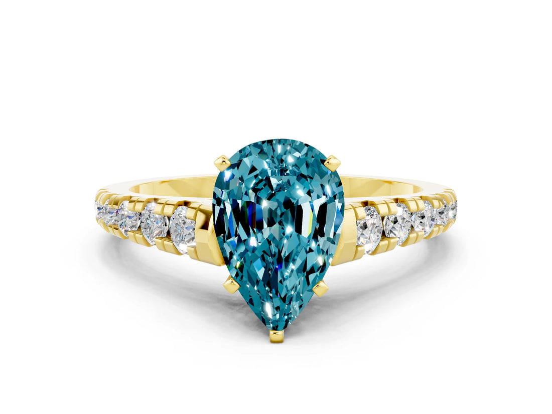 Yellow gold Pear Cut Blue Topaz Solitaire Ring with Cathedral Setting and Pavé Band