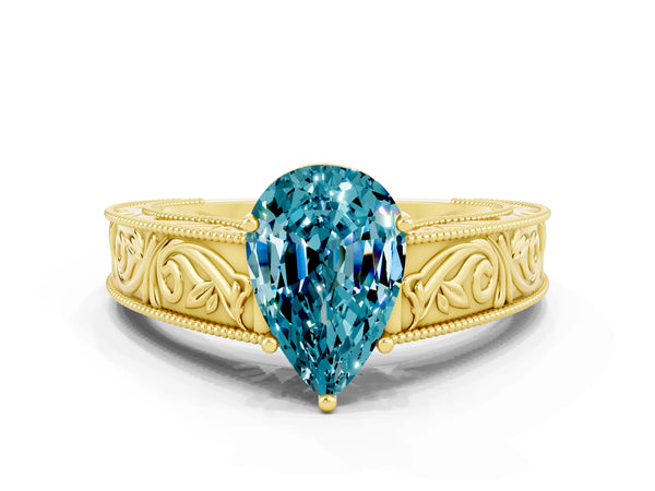 Yellow gold Pear Cut Blue Topaz Solitaire Ring with Engraved Band and Four-Prong Setting