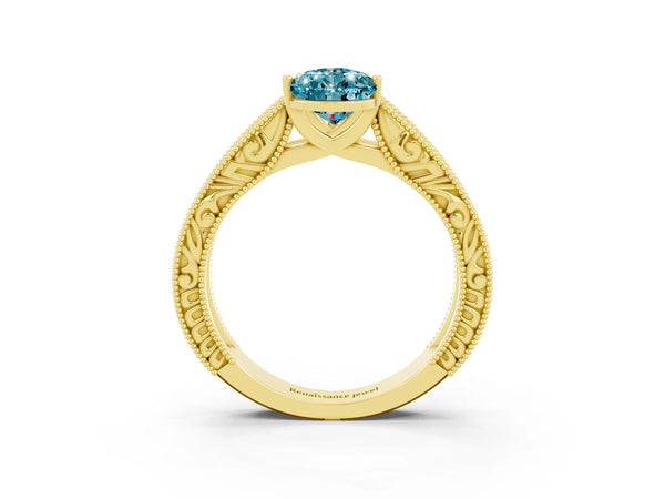 Yellow gold Pear Cut Blue Topaz Solitaire Ring with Engraved Band and Four-Prong Setting