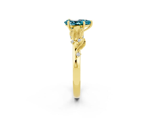 Yellow gold Pear Cut Blue Topaz Solitaire Ring with Leaf Motif Band and Four-Prong Setting