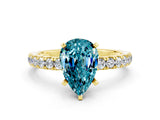 Yellow gold Pear Cut Blue Topaz Solitaire Ring with Pavé Accents and Four-Prong Setting