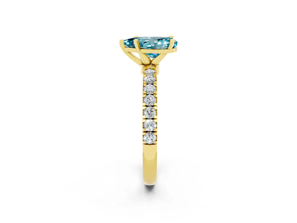 Yellow gold Pear Cut Blue Topaz Solitaire Ring with Pavé Accents and Four-Prong Setting