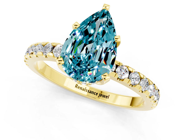 Yellow gold Pear Cut Blue Topaz Solitaire Ring with Round Pavé Band and Four-Prong Setting
