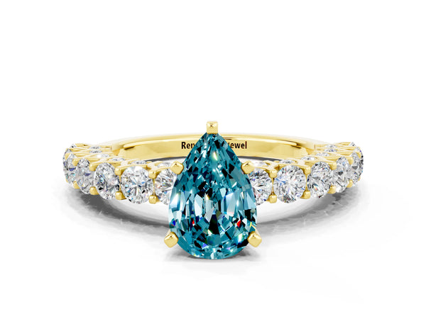 Yellow gold Pear Cut Blue Topaz Solitaire Ring with Shared Prong Pavé Band and Four-Prong Setting