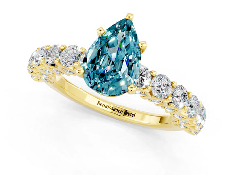 Yellow gold Pear Cut Blue Topaz Solitaire Ring with Shared Prong Pavé Band and Four-Prong Setting_1