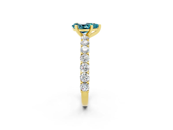 Yellow gold Pear Cut Blue Topaz Solitaire Ring with Shared Prong Pavé Band and Four-Prong Setting