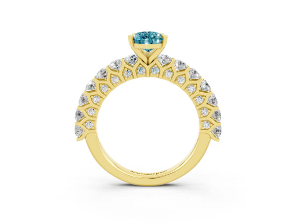 Yellow gold Pear Cut Blue Topaz Solitaire Ring with Shared Prong Pavé Band and Four-Prong Setting