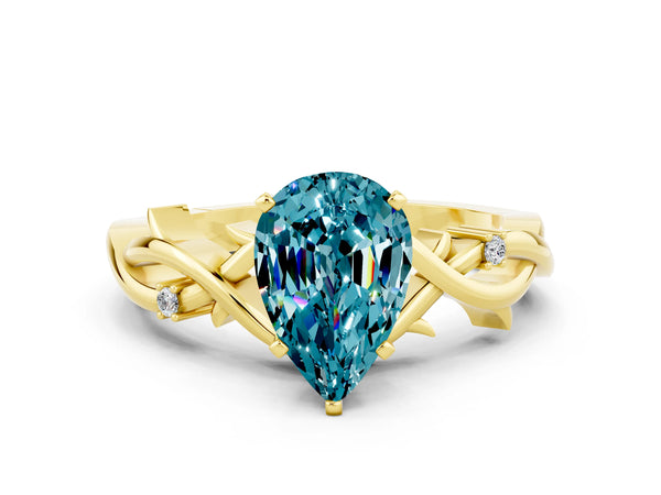 Yellow gold Pear Cut Blue Topaz Solitaire Ring with Twisted Band and Prong Setting