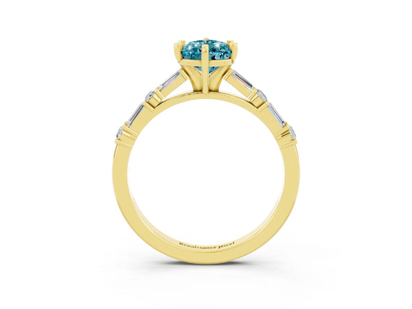Yellow gold Pear Cut Blue Topaz Solitaire with Side Baguettes and Channel Set Band