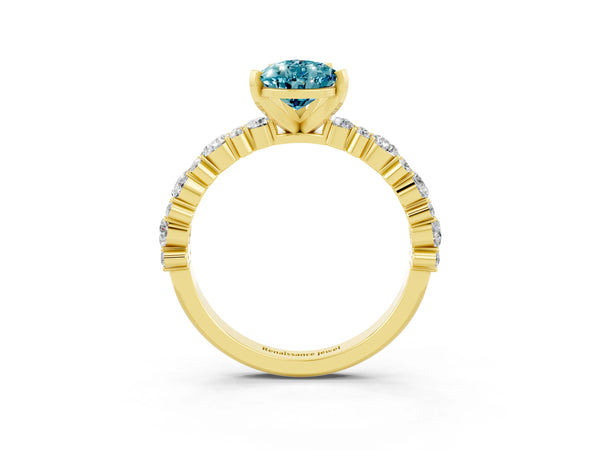 Yellow gold Pear Cut Blue Topaz Side Stone Solitaire Ring with Round  and Four-Prong Setting