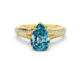 Yellow gold Pear Cut Blue Topaz Split Shank Engagement Ring with Pavé Band