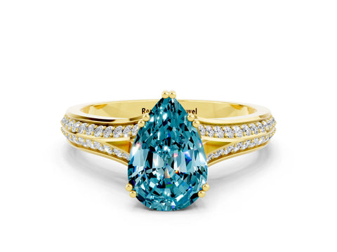 Yellow gold Pear Cut Blue Topaz Split Shank Engagement Ring with Pavé Band