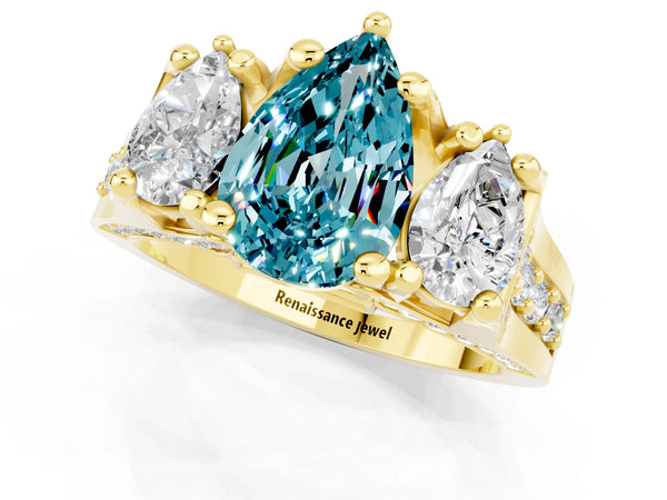 Yellow gold Pear Cut Blue Topaz Three-Stone Ring with Channel Set Band and Four-Prong Setting