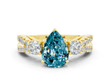 Yellow gold Pear Cut Blue Topaz Three-Stone Ring with Pavé Split Shank and Four-Prong Setting_12