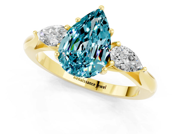 Yellow gold Pear Cut Blue Topaz Three-Stone Ring with Pear  Side Stones and Prong Setting
